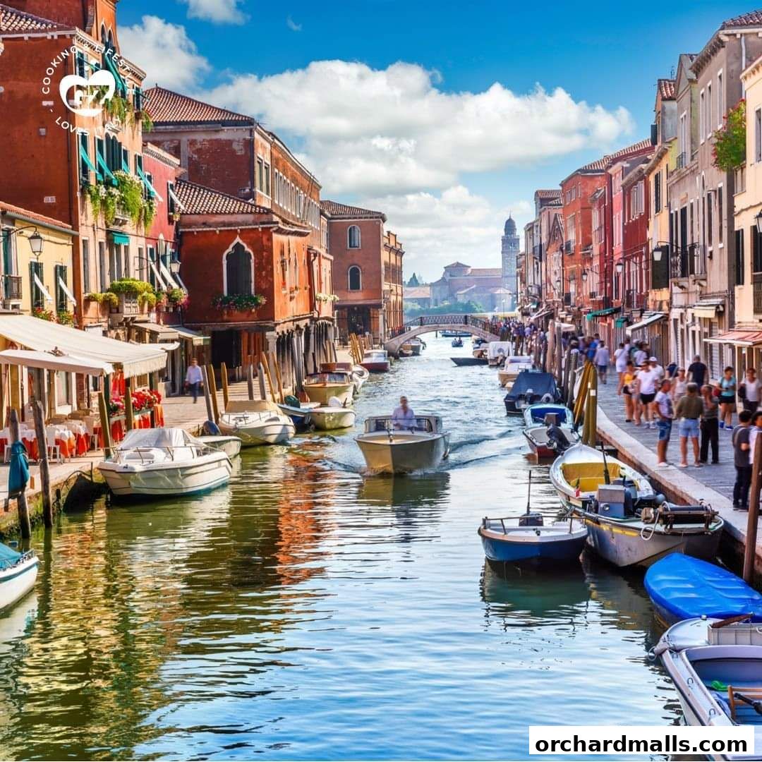 A scenic canal in Venice with boats and buildings lining the waterway.