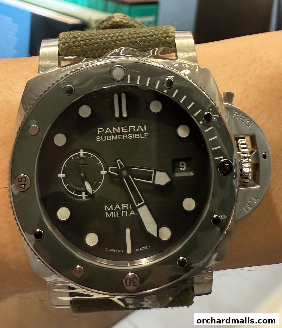 Close-up of a Panerai Submersible Marina Militare watch on a wrist.