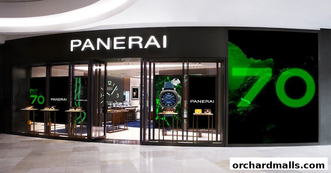 The exterior of a Panerai Boutique with illuminated signage and display windows showcasing watches.