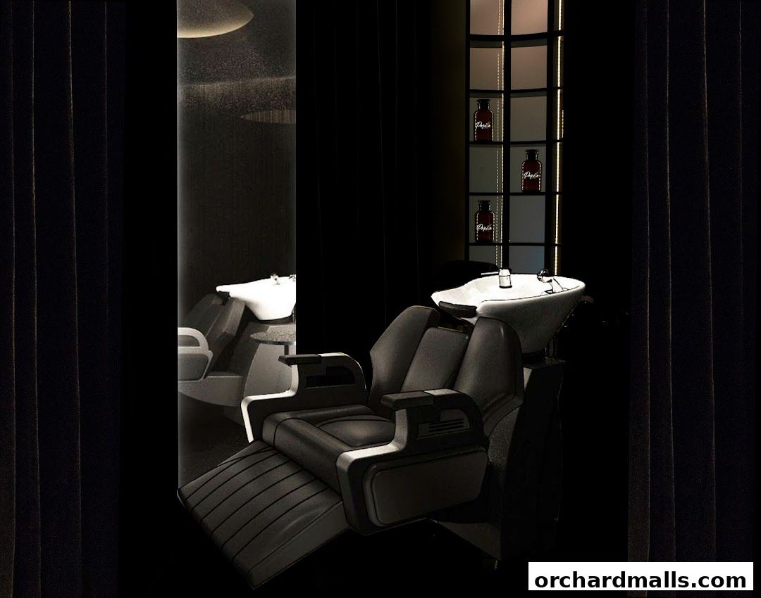 Luxurious barber chairs and sinks in a dimly lit, modern salon.