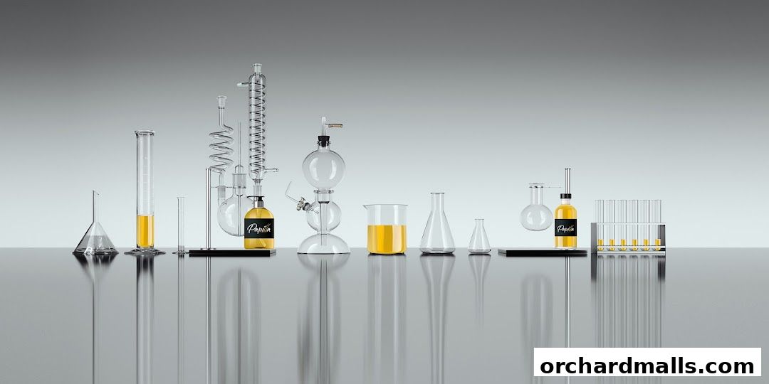 Laboratory glassware and bottles with yellow liquid, branded 'Papilla By Kim Lim'.