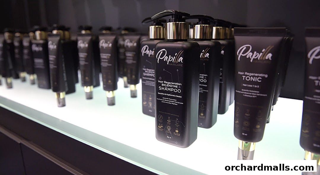 Rows of Papilla Haircare products, including shampoo and tonic, displayed on shelves.