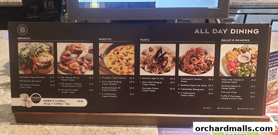 A menu board from Paris Baguette showcasing brunch, risotto, pasta, and salad dishes with prices.