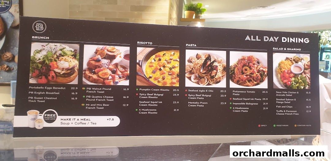 A menu board from Paris Baguette showcasing brunch, risotto, pasta, and salad dishes with prices.