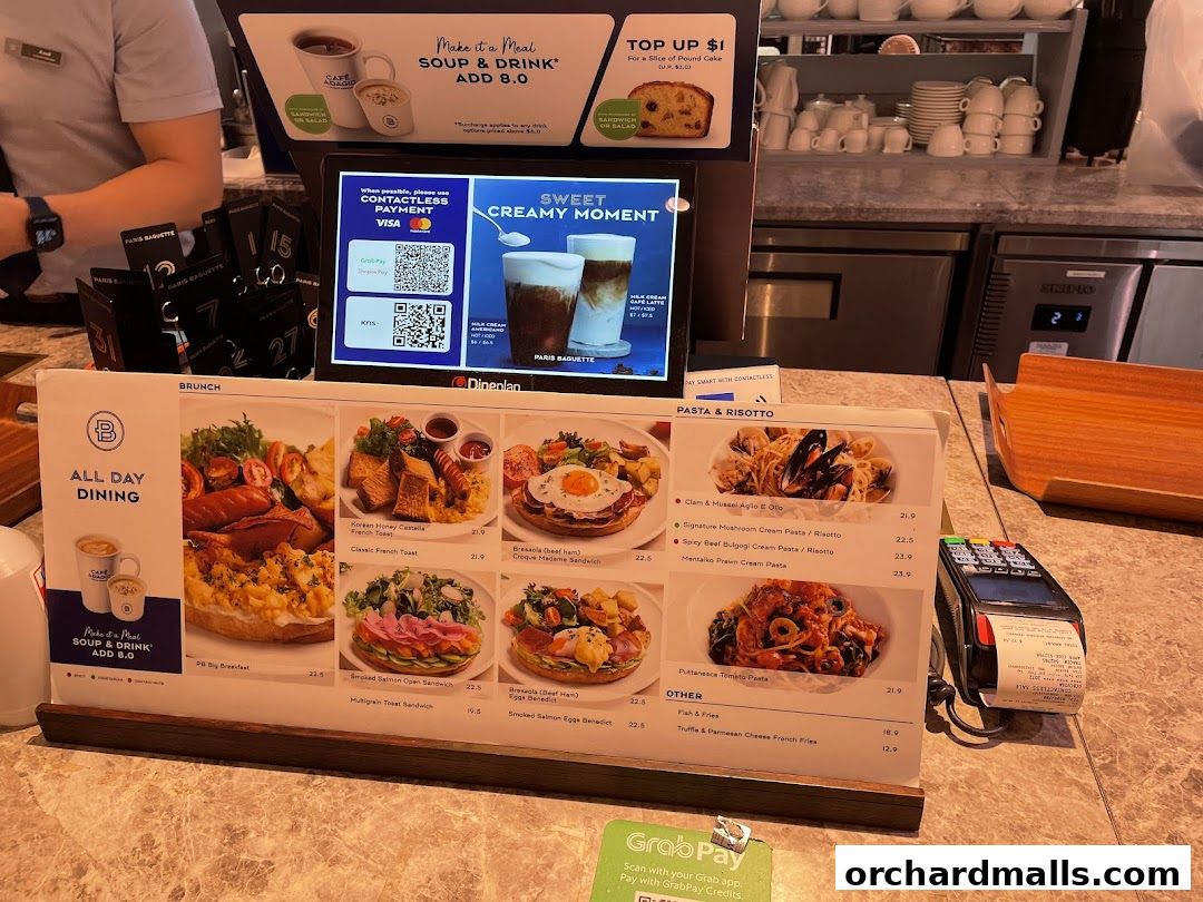 A Paris Baguette menu displaying brunch, pasta, risotto, and other dishes with prices.