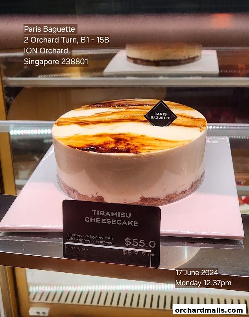 A Tiramisu Cheesecake from Paris Baguette displayed in a chilled cabinet.