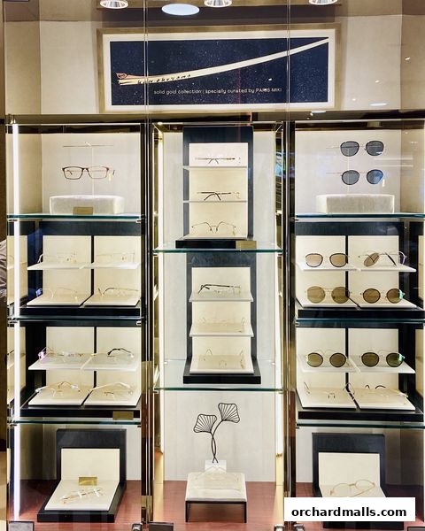 A display case filled with various eyeglasses and sunglasses, showcasing different styles and brands.