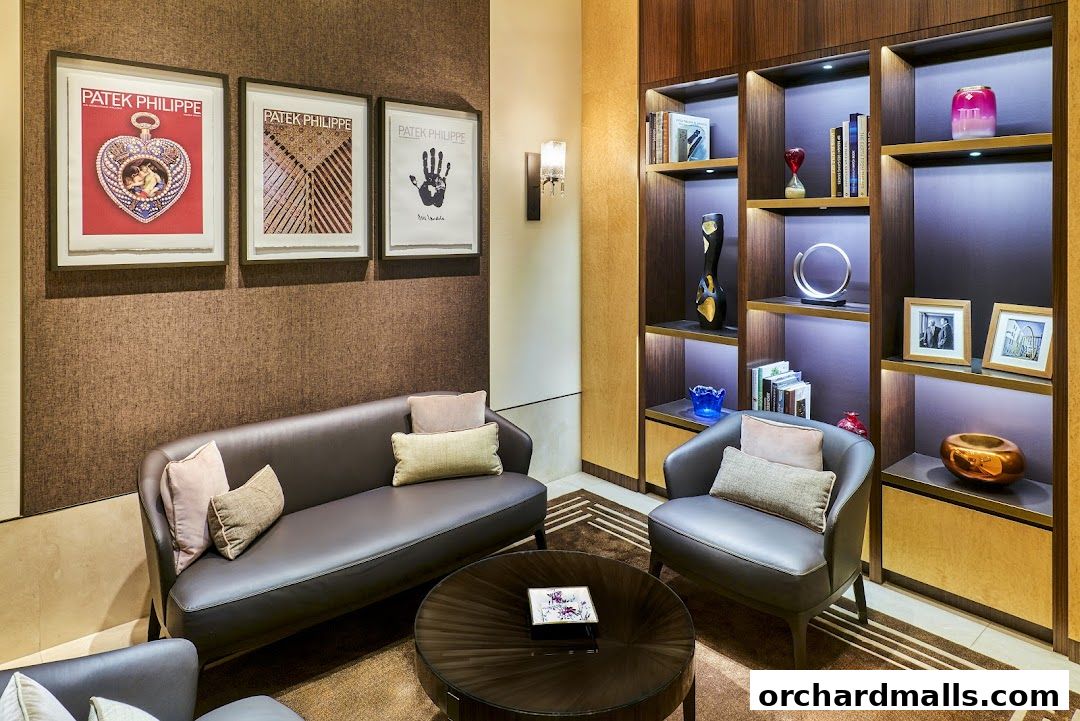 Luxurious lounge area with Patek Philippe artwork and elegant furnishings.