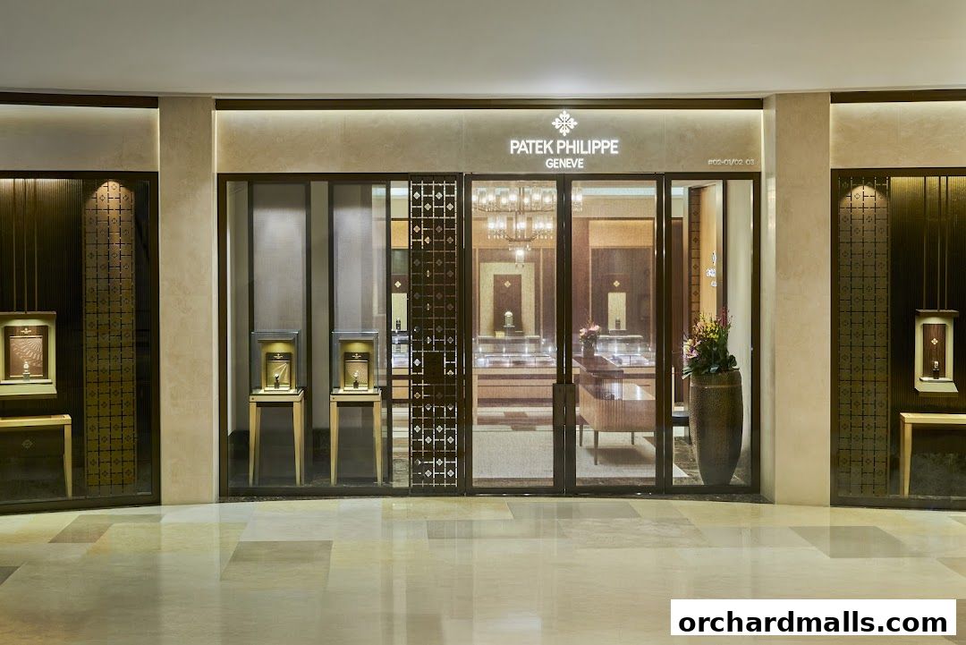 The elegant storefront of a Patek Philippe boutique, showcasing luxury watches in illuminated display cases.