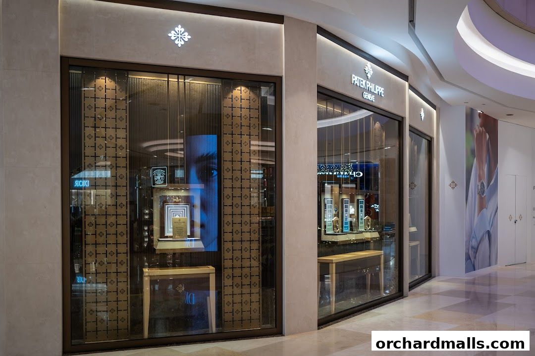 The elegant storefront of a Patek Philippe boutique, showcasing luxury watches in illuminated display cases.