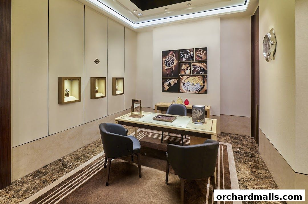 Interior of a Patek Philippe boutique with display cases, seating, and artwork.