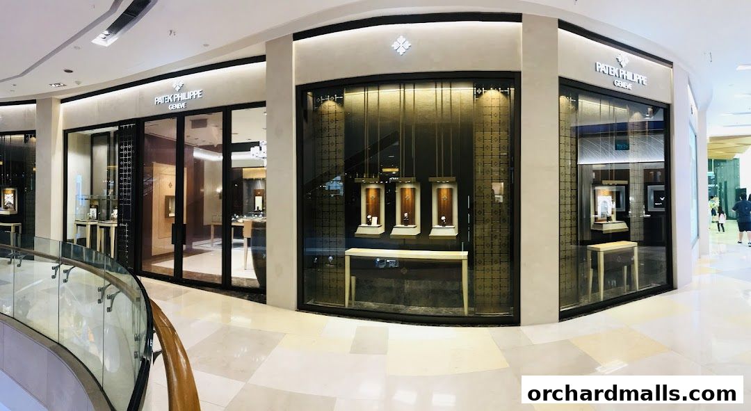 The exterior of a Patek Philippe boutique, showcasing luxury watches in display windows.