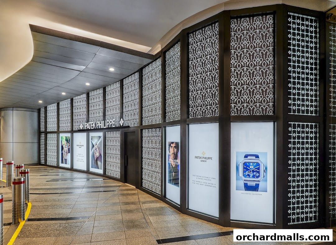 The elegant exterior of a Patek Philippe boutique with illuminated displays showcasing watches.