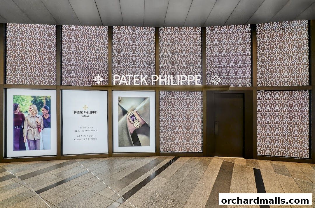 The Patek Philippe boutique entrance with illuminated signage and product displays.