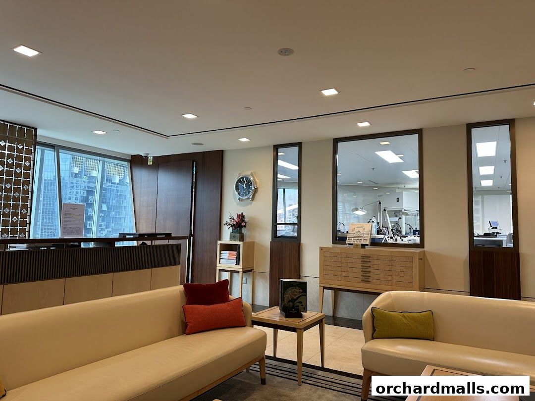Interior of a Patek Philippe customer service center with seating and workshop views.