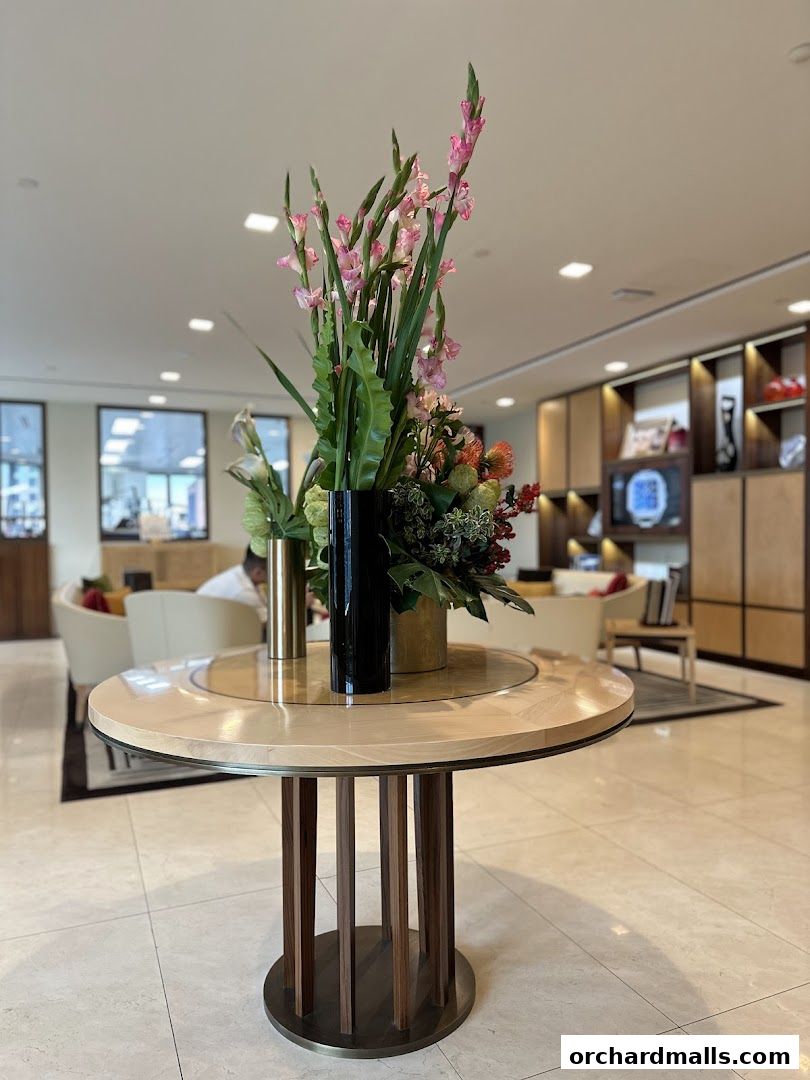 Elegant interior with a floral centerpiece on a round table.