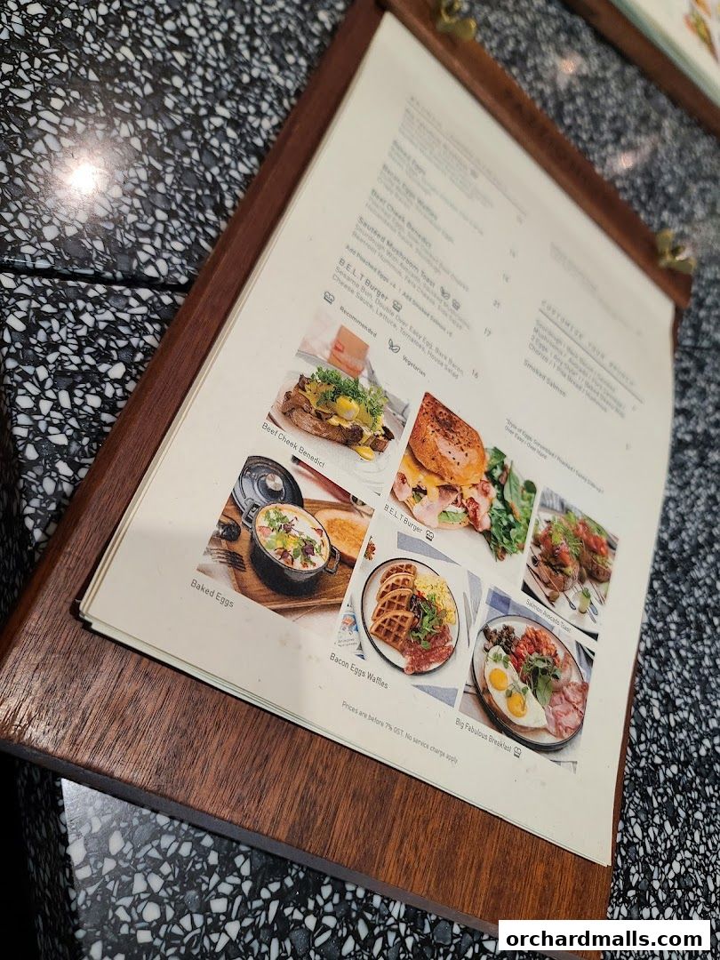 A menu from Pazzion Cafe showcasing various breakfast and burger dishes with appealing images.