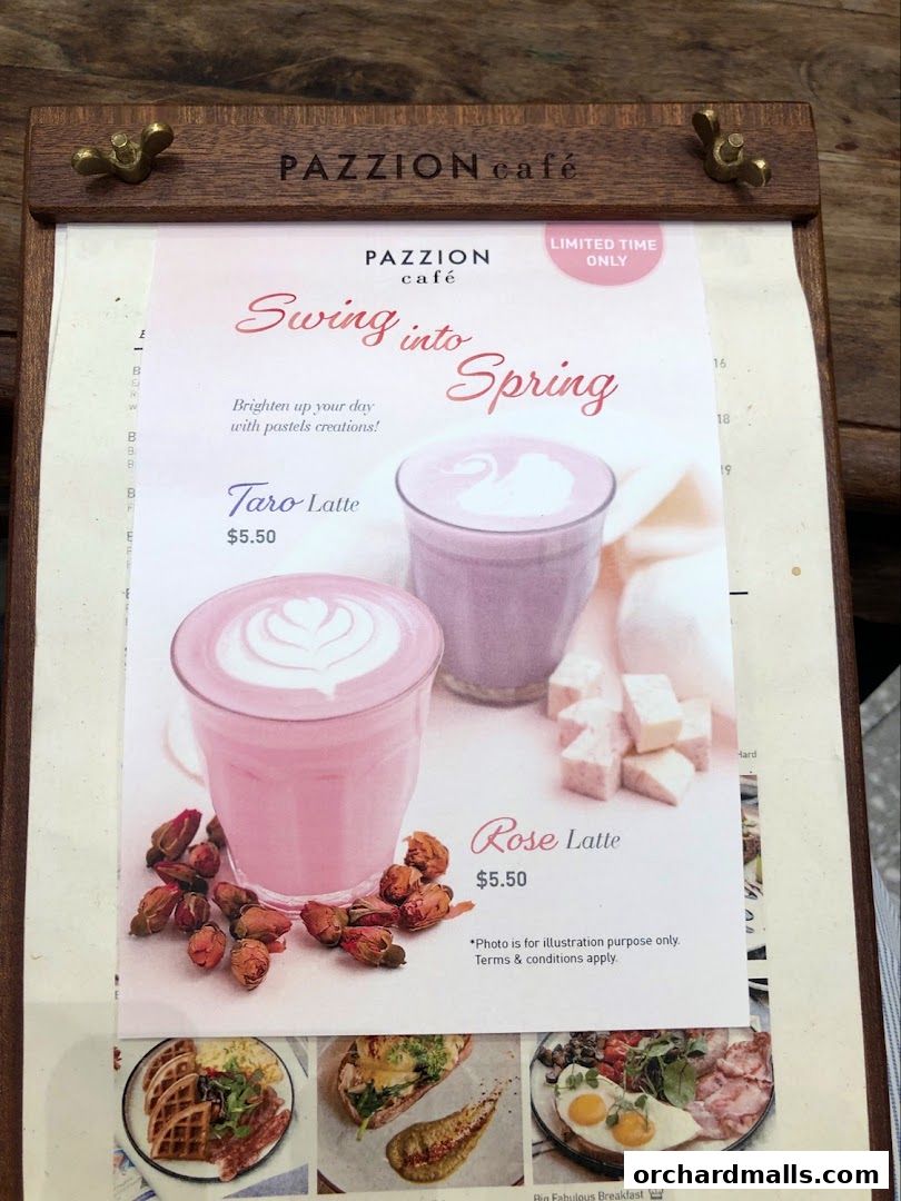 A menu board from Pazzion Cafe featuring spring-themed pastel lattes and breakfast items.