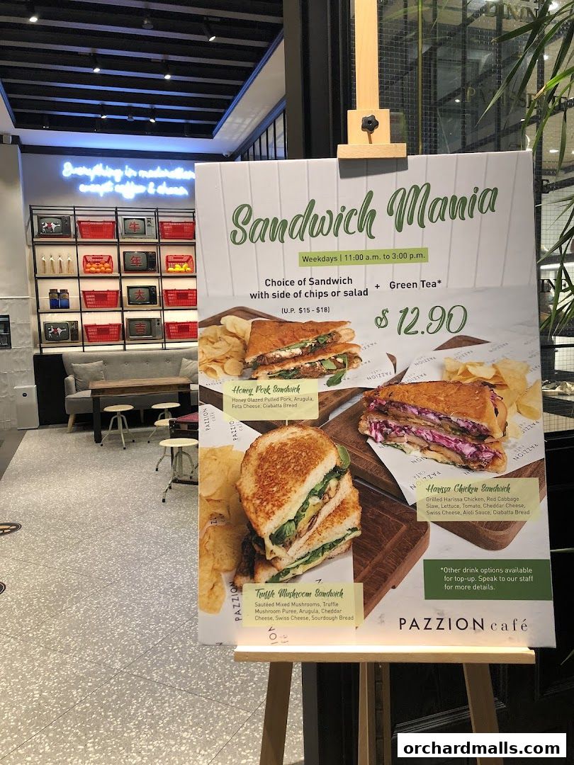 A sandwich menu board from Pazzion Cafe featuring three sandwich options and prices.
