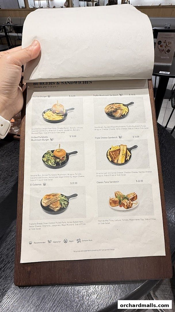 A menu from Pazzion Cafe featuring burgers and sandwiches with enticing descriptions and prices.