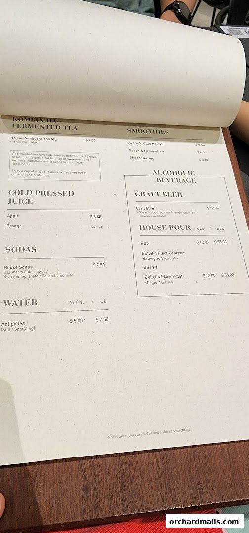 A menu from Pazzion Cafe featuring kombucha, smoothies, juices, sodas, water, craft beer, and house pour wines.