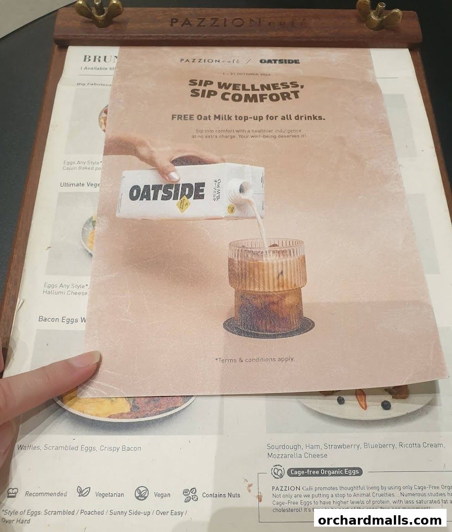 A menu page from Pazzion Cafe featuring a promotion for free oat milk top-ups.