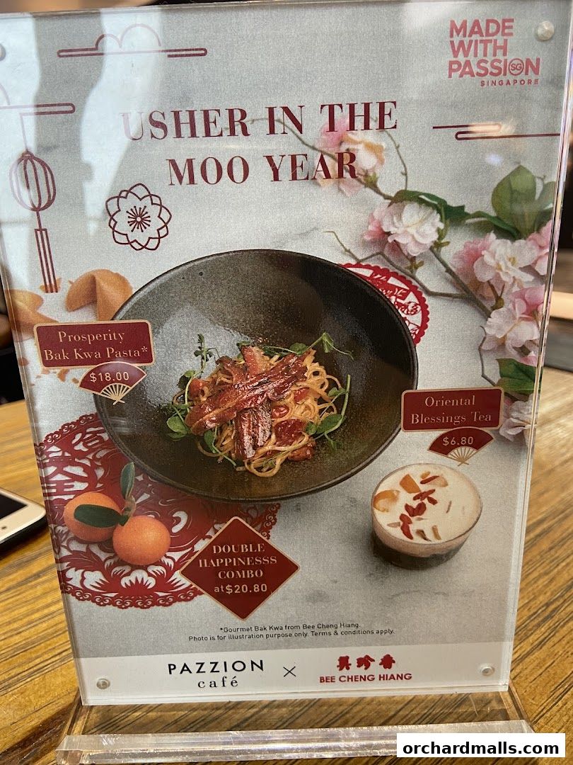 A menu featuring Prosperity Bak Kwa Pasta and Oriental Blessings Tea for the Lunar New Year.