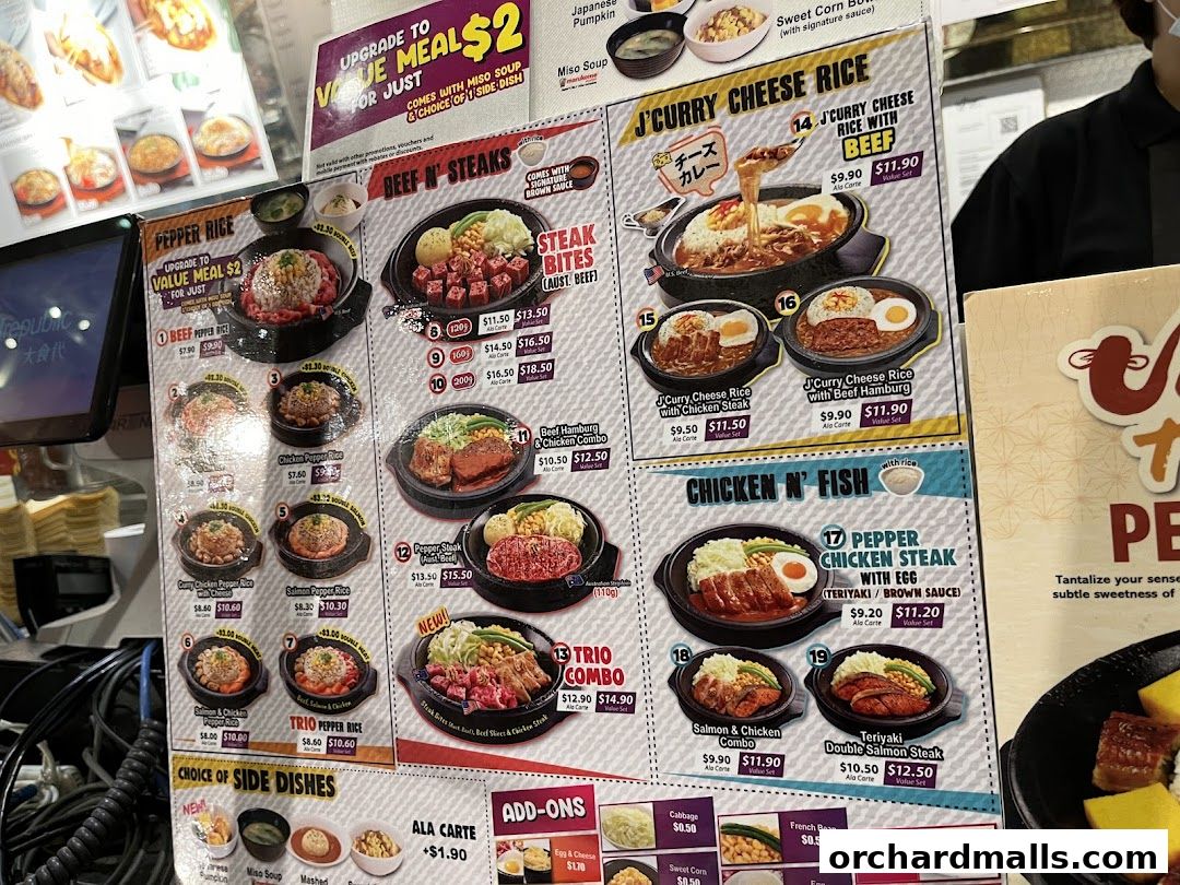 A menu board displaying various rice dishes, steak, and chicken meals with prices.