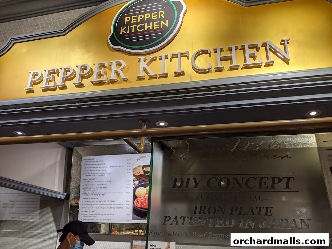 The exterior signage and menu of Pepper Kitchen, a restaurant specializing in DIY iron plate dishes.