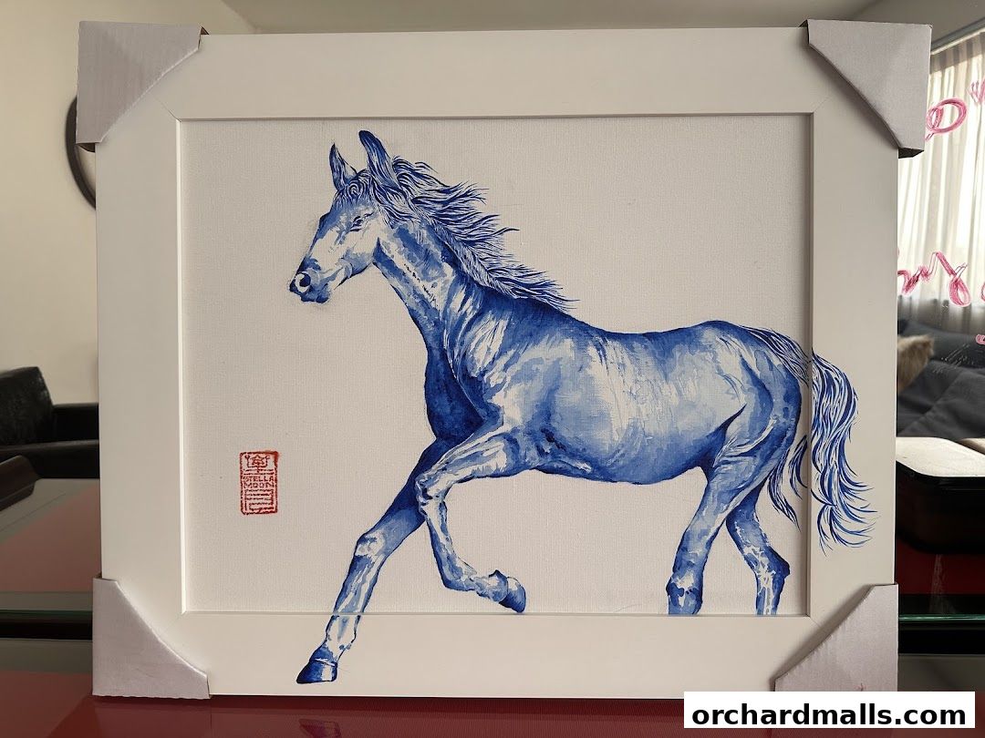 A framed blue watercolor painting of a horse in motion with a red artist's seal.