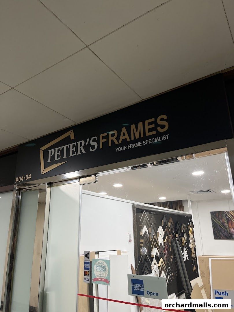 The exterior of Peter's Frames, a custom framing shop, with its signage and entrance visible.