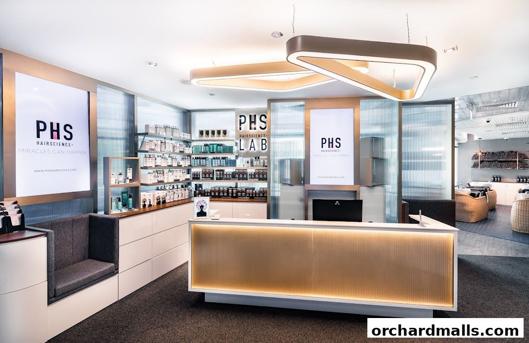 Interior view of PHS Hairscience Lab with reception desk and product displays.