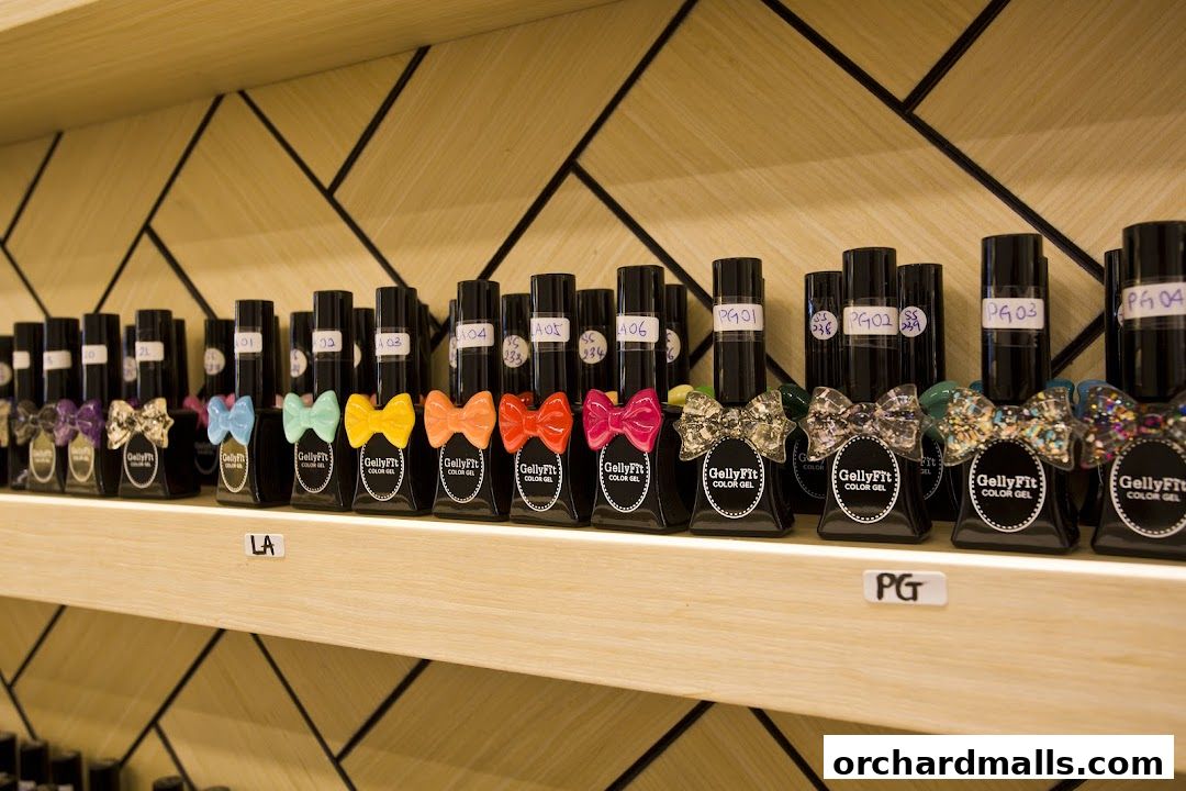 A shelf displaying rows of colorful Gelly Fit nail polish bottles with decorative bows.