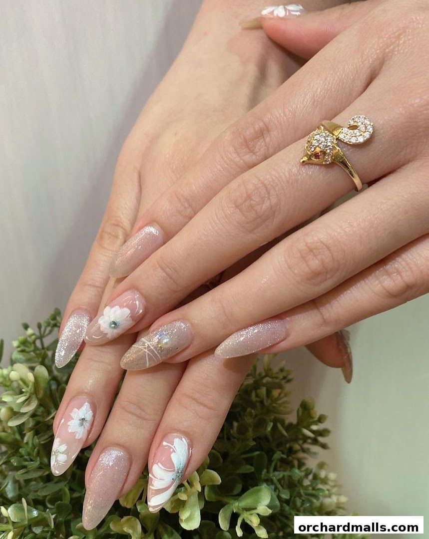 Close-up of hands with elegant floral nail art and a sparkling ring.