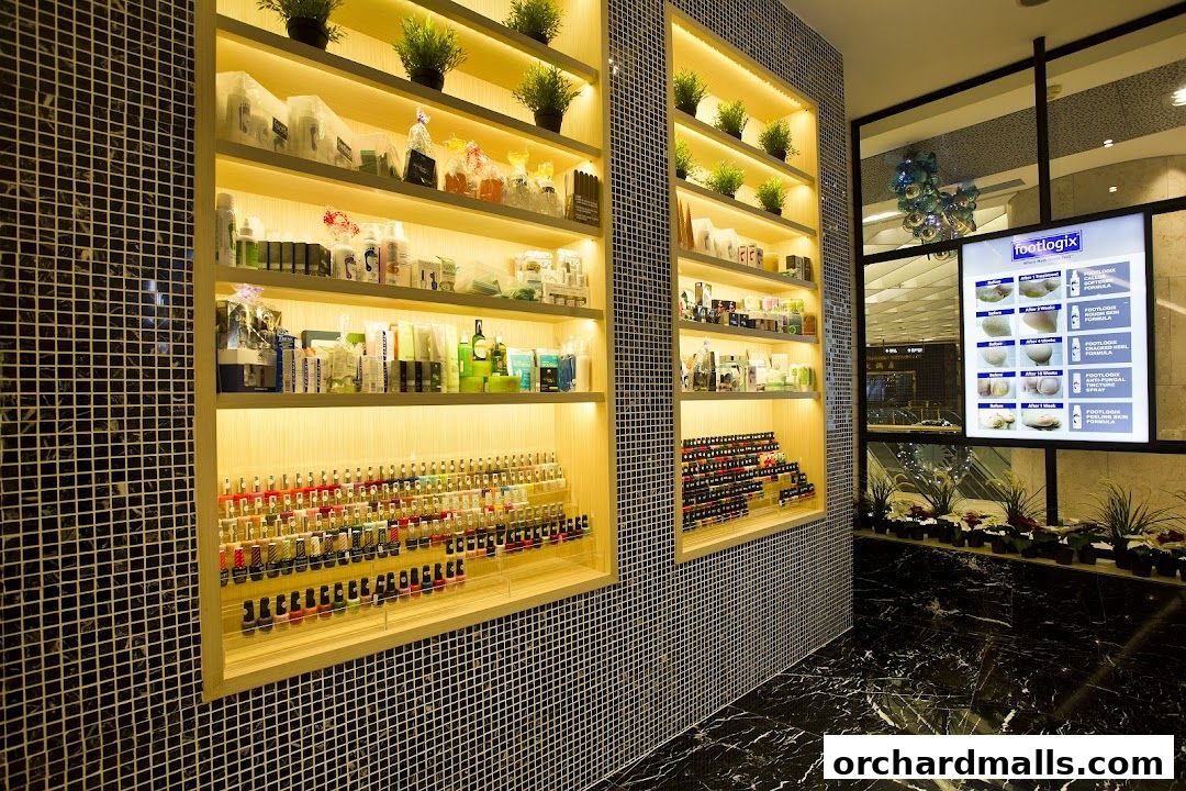 Shelves stocked with nail polish and spa products, with a display showing before and after foot treatments.