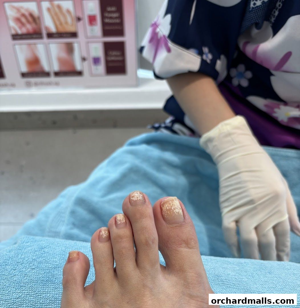 A close-up of a foot receiving a pedicure at Picota Nail Spa.