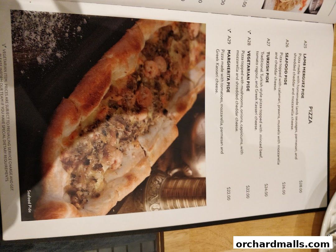A menu page featuring various pizzas and pides from Pistachio Middle Eastern Mediterranean Grill.