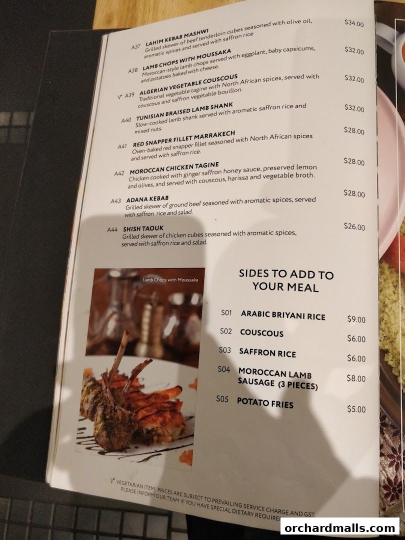A menu from Pistachio Middle Eastern Mediterranean Grill featuring main courses and sides.