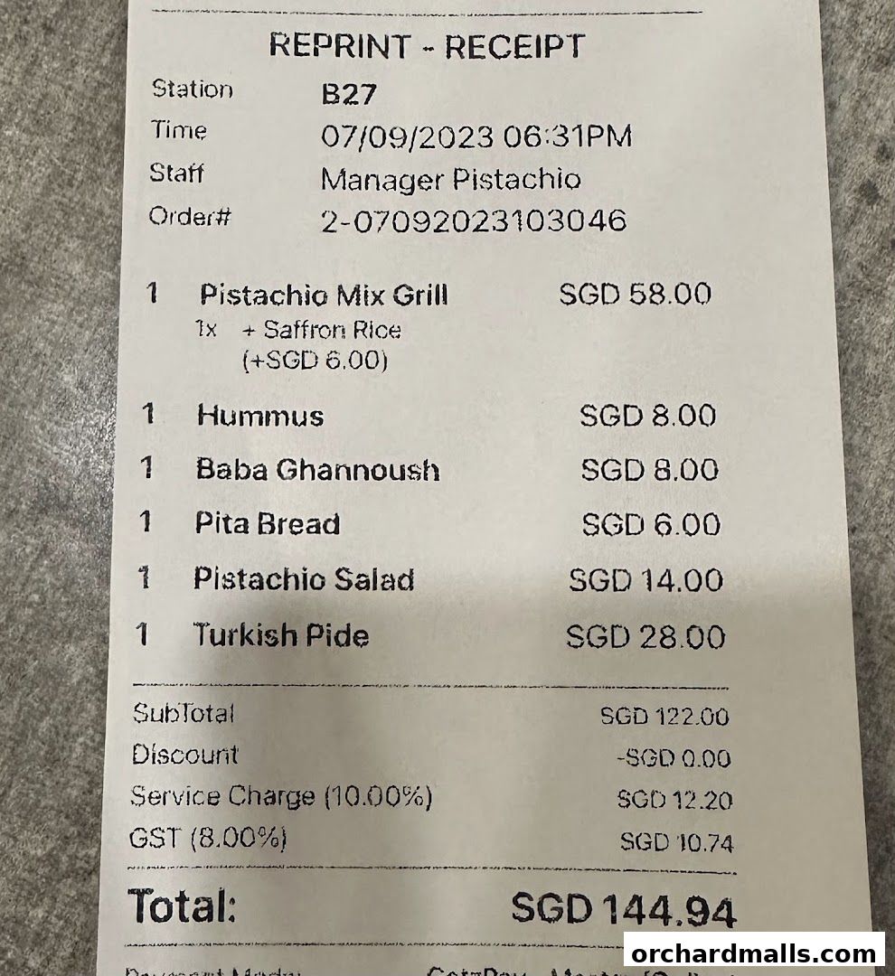 A receipt from Pistachio Middle Eastern Mediterranean Grill showing purchased items and total cost.