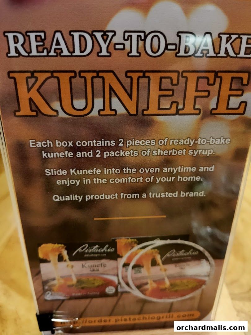 A sign advertising ready-to-bake Kunefe from Pistachio Middle Eastern Mediterranean Grill.