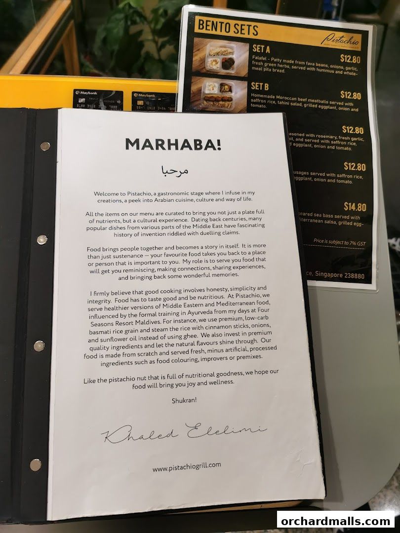 A menu from Pistachio Middle Eastern Mediterranean Grill with bento sets and descriptions.