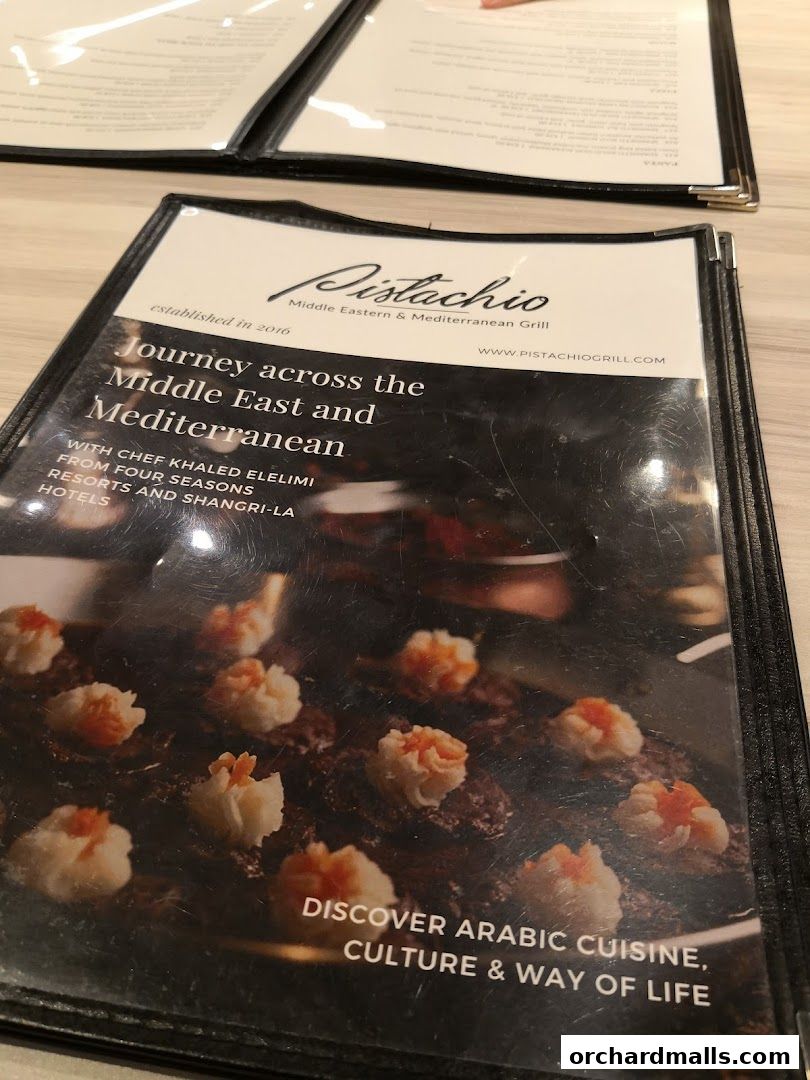 A menu from Pistachio Middle Eastern & Mediterranean Grill showcasing their cuisine.