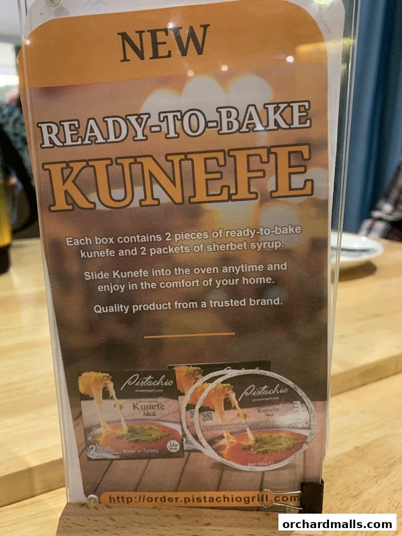 A sign advertising Pistachio's new ready-to-bake Kunefe dessert.