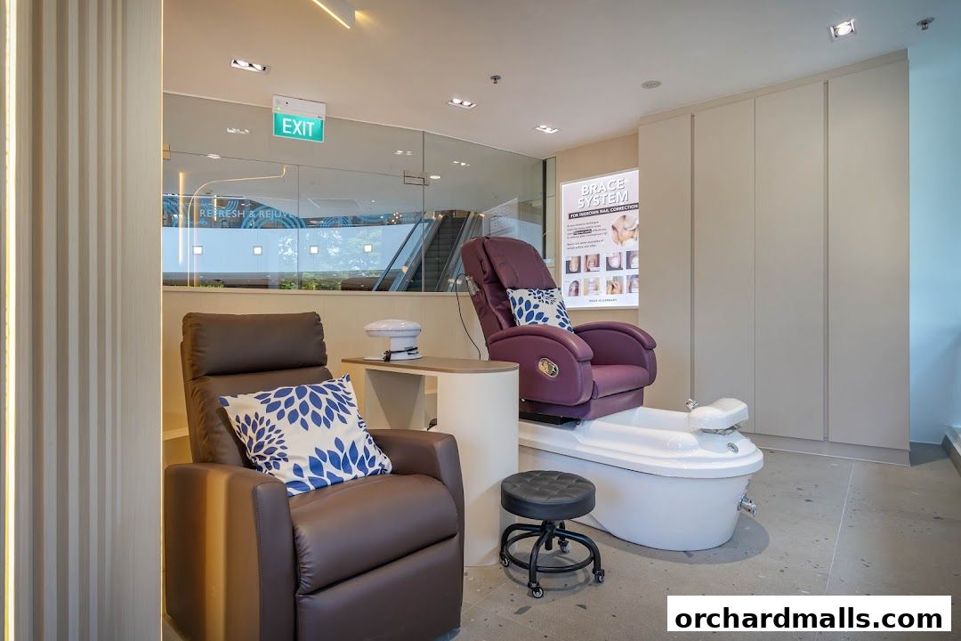 Interior of a nail spa with pedicure chairs, a foot bath, and a display for nail correction.