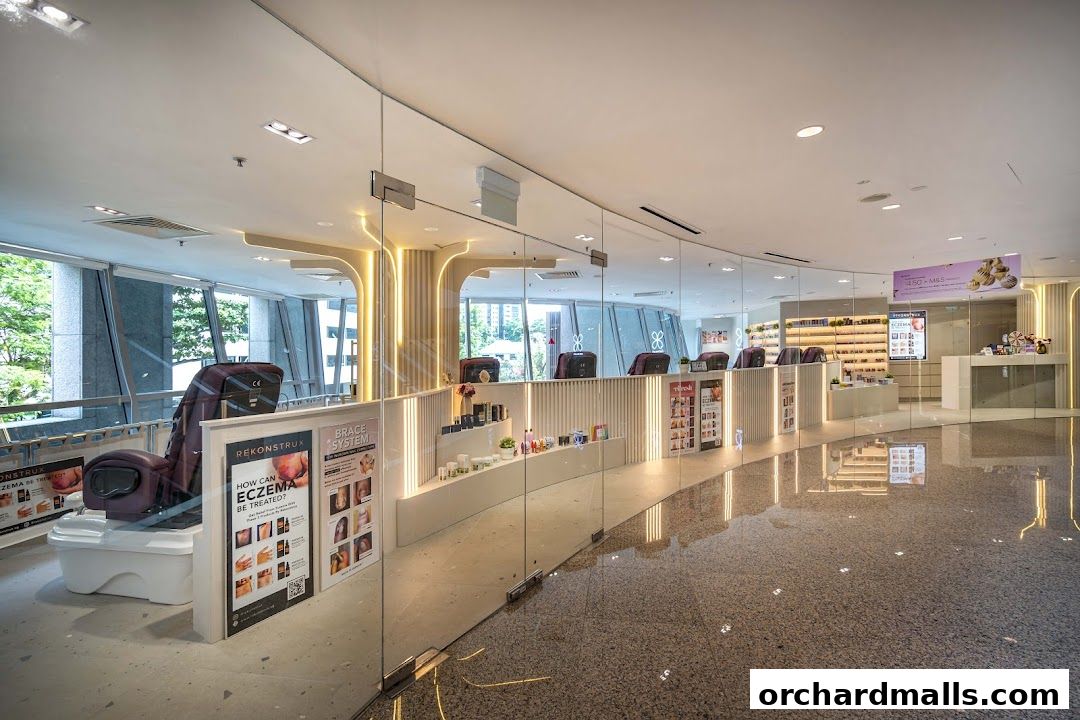 Interior view of a modern nail spa with massage chairs and product displays.