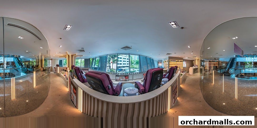 Interior view of a modern nail spa with pedicure chairs and product displays.