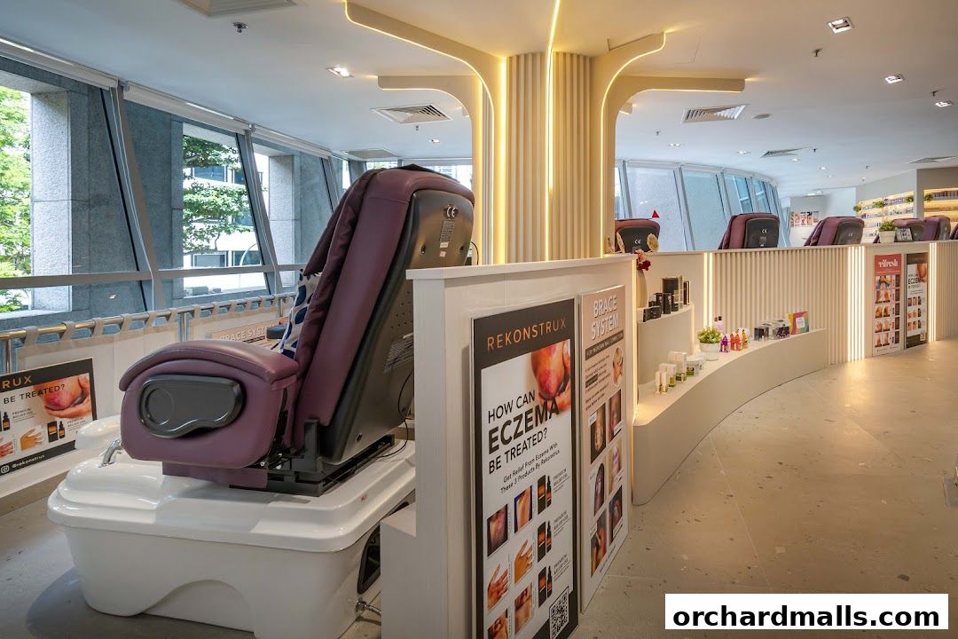 Interior of a nail spa with massage chairs and display shelves of beauty products.