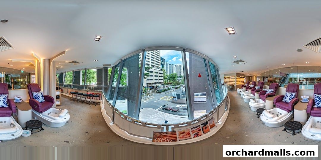 Interior view of a nail spa with pedicure chairs and a view of the city.