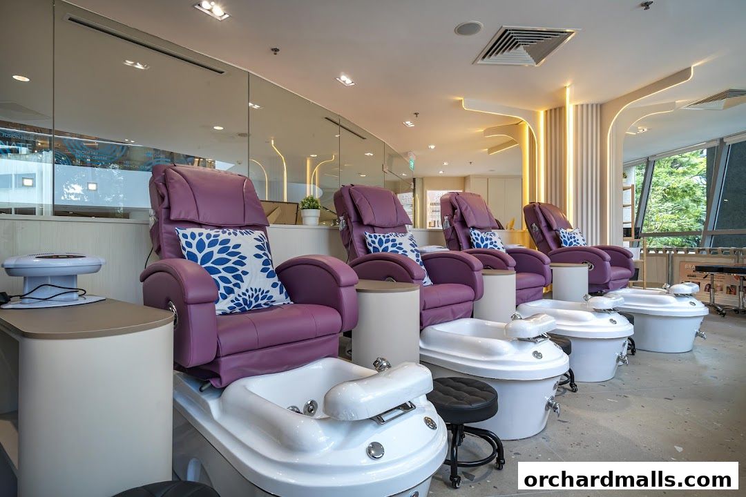 Luxurious purple pedicure chairs with built-in foot baths in a modern spa.