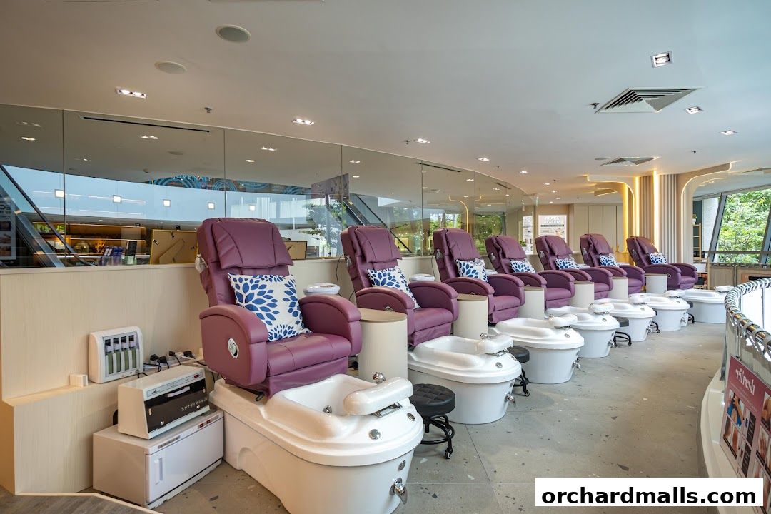 Luxurious purple pedicure chairs with built-in foot baths line the spacious interior of a nail spa.